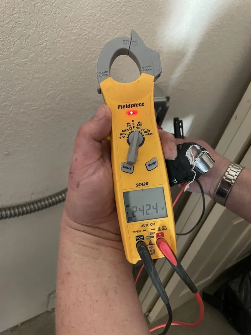 Voltage testing with clamp meter during Whole House Surge Protector in Youngstown